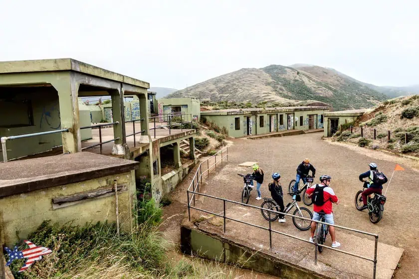 Battery Spencer in bicicletta